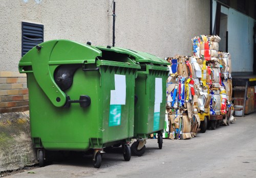 Securely loaded vehicle and labelled waste containers ready for transport
